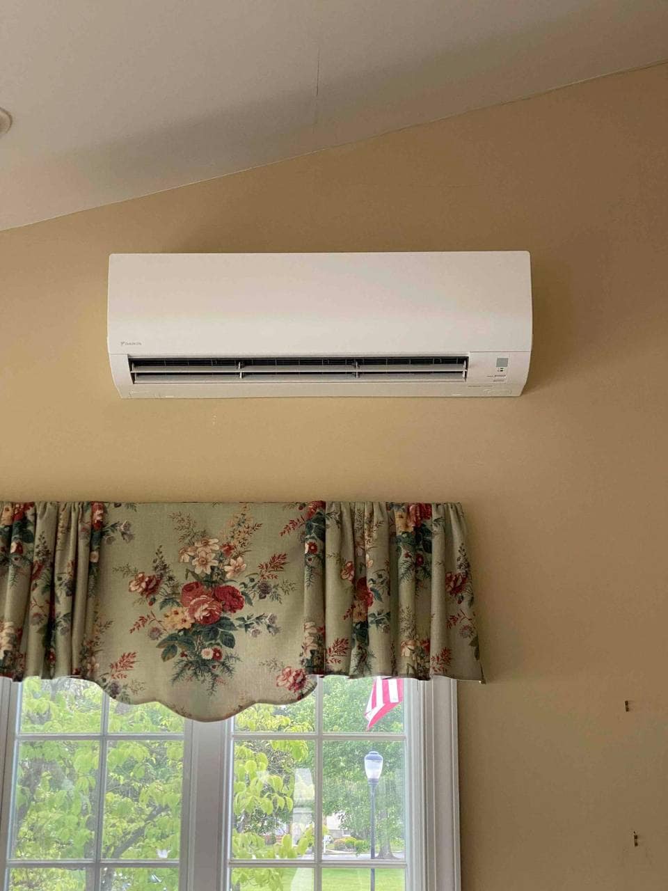 Indoor ductless unit above a window.